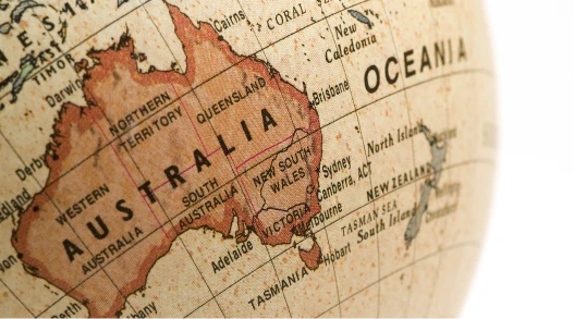 a woman standing on a rock looking out over a valley